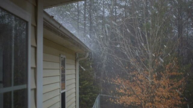 Hailstorm causing roof damage to house 