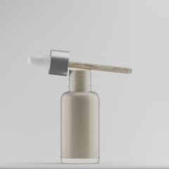 A clear glass dropper bottle with a silver cap and a wooden pipette rests on a minimalist grey background. The bottle is partially filled with a pale, creamy liquid. 