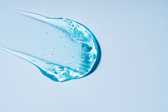 Blue gel texture with bubbles on light background