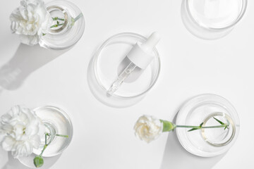 Laboratory serums and flowers in skincare research