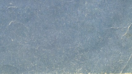 Old blue book cover background. Texture of vintage cardboard.