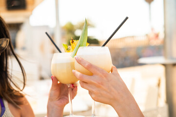 Refreshing tropical cocktails with pineapple garnish in summer