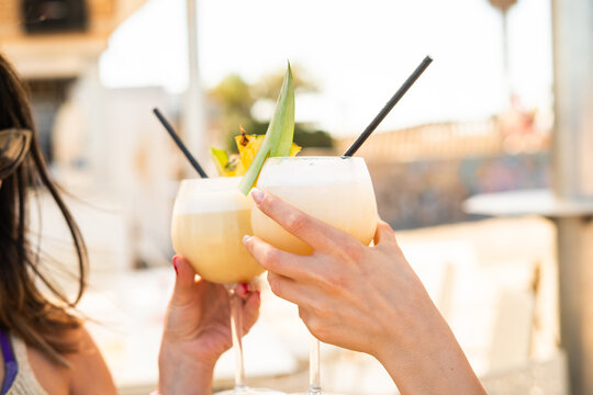 Refreshing tropical cocktails with pineapple garnish in summer