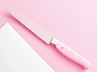 Pink Knife on Pink Background with Paper