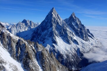 Majestic Winter Mountain Peaks - Breathtaking panoramic view of snow-capped mountain peaks against a clear blue sky. Serene winter landscape