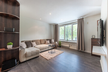 Modern Home Living Room Interior with Large Windows and Comfortable Furniture