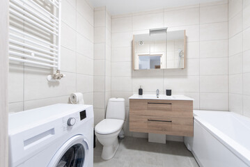 Modern Home Bathroom Interior with Washing Machine and Minimalistic Design