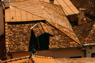 A stunning aerial view showcases charming rustic rooftops in warm earthy tones, inviting admiration