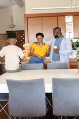 Obraz premium Family enjoying quality time together at home, smiling and sharing joyful moments