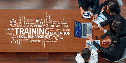 A diverse team collaborates during a professional meeting emphasizing training and skill...