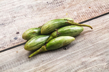 Small organic young green eggplant
