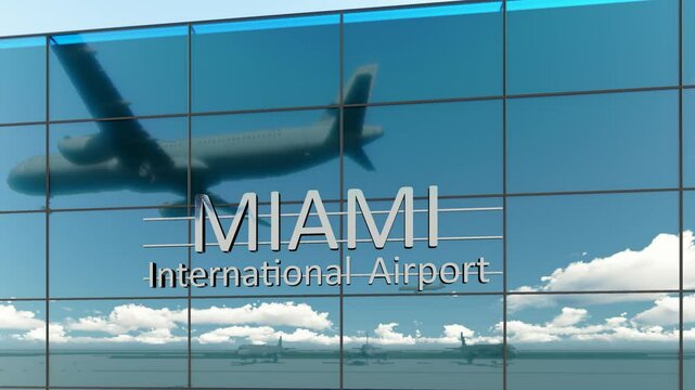 Miami international airport. Plane landing at Miami. Arrival in the city with the glass airport terminal and reflection of the jet aircraft. Travel, business, tourism and transport.	