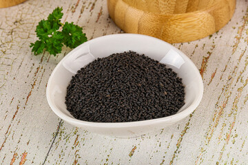 Black dry Nigella seeds in the bowl