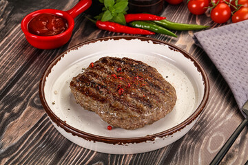 Grilled beef burger cutlet with sauce