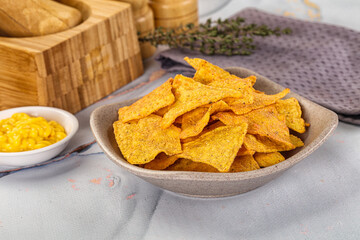 Corn nachos chips with cheese dip