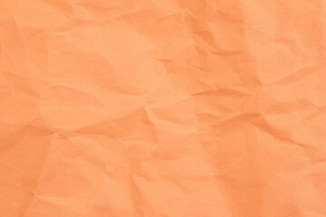 Fototapeta premium Crumpled orange paper with wrinkled and textured background