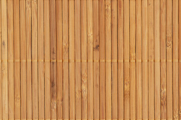 Fototapeta premium Natural light brown wooden bamboo mat background
