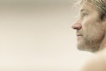 portrait of swimming coach on left side of frame showcasing inspired emotion