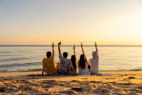 asian, beach, beer, beer bottle, celebrate, celebrating, celebration, cheerful, cheers, clinking, drink, enjoy, enjoyment, family, freedom, friend, friendship, fun, group, hand, happiness, happy, hold - Powered by Adobe