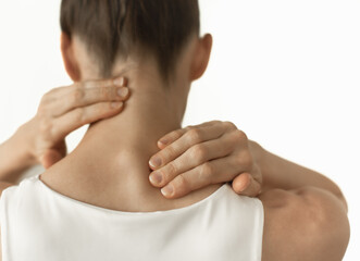 Obraz premium closeup of person with neck pain isolated on white background 