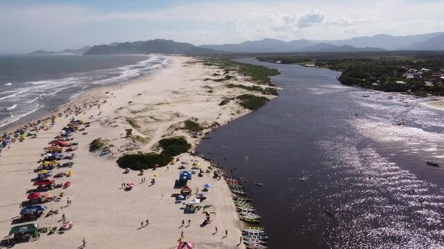 4K Drone Pullback Over Guarda do Emba&uacute; Beach, River and Mountains &ndash; Brazil