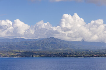 Scenic View Of Kauai's Mountain Range With Blue Ocean and Sky