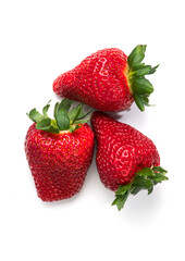 Strawberry isolated on white background. Three Fresh ripe organic strawberries, macro shot of fresh juicy berries, top view, close up, flat lay 