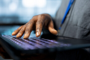Admin in data center typing on notebook keyboard, using automation tools, doing predictive...