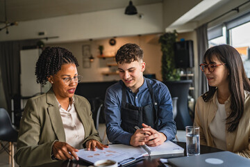 young man entrepreneur on the meeting with female financial advisers