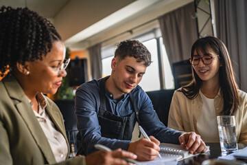 young man entrepreneur on the meeting with female financial advisers