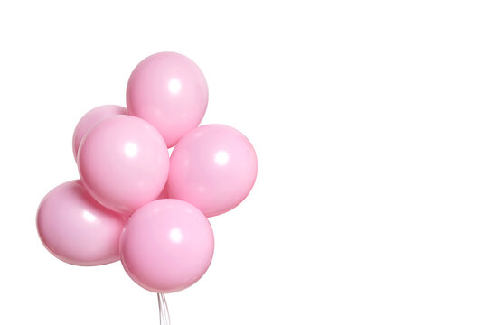 flying pink balloons on neutral background