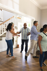 Dancing joyfully at home, seniors celebrating together during lively gathering