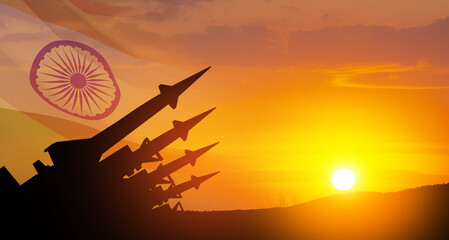The missiles are aimed at the sky at sunset with Indian flag. Nuclear bomb, chemical weapons,...