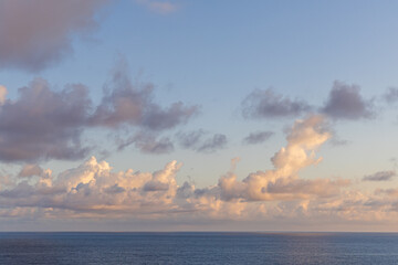 Serene Pacific Ocean Horizon with Soft Clouds and Tranquil Sky