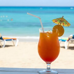 Obraz premium a nice orange cocktail juice on the beach