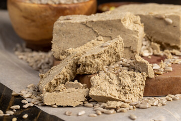halva from sunflower seeds closeup, delicious dessert made from fried sunflower seeds