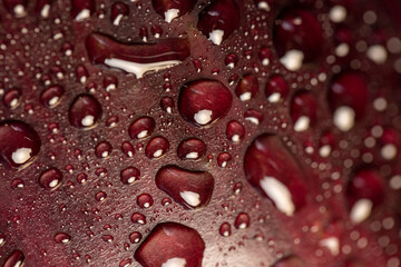 one wet ripe purple eggplant covered with drops of water , ripe eggplant on the table before cooking, close up
