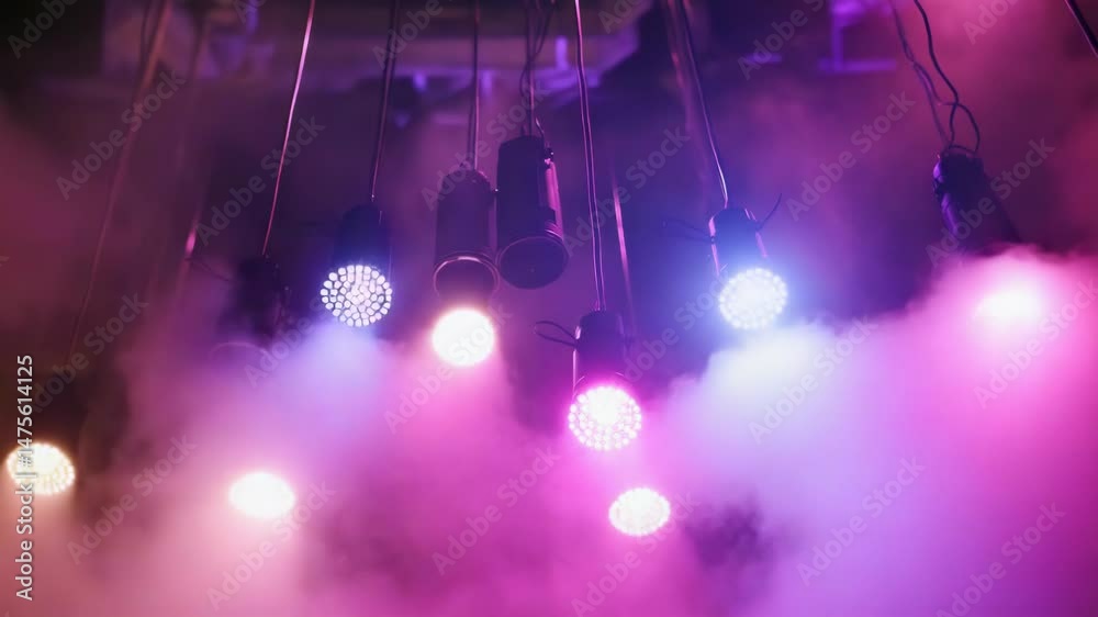 Poster a bunch of string lights hanging from the ceiling, perfect for various events and celebrations