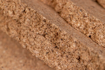 natural soft and durable material that is obtained from the bark of a cork tree closeup, broken cork wood panel