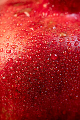 a sweet pomegranate in drops of clear water in the kitchen