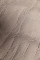 part of the fabric from which the mattress is sewn after prolonged use