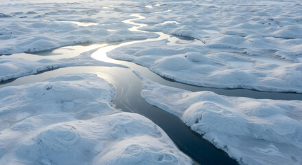 Arctic Serenity: Frozen River Meandering Through A Snow Covered Landscape