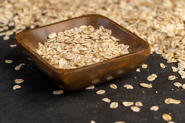 bowl and oatmeal for quick cooking of porridge, closeup