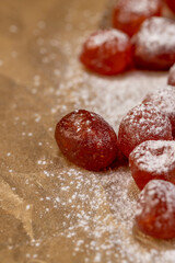 sweet dehydrated candied fruits of kumquat on paper