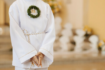 Child Praying with Folded Hands During First Holy Communion Ceremony