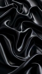 Smooth, soft, shiny black silk satin fabric with a rippled texture creates an elegant and luxurious backdrop