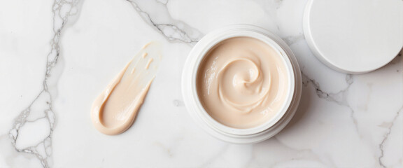 Luxury skincare flat lay with cream and smear on marble, beauty concept