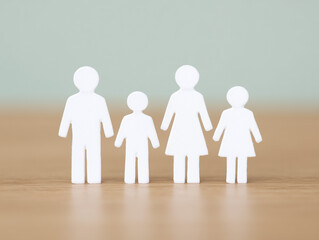 Family Figurines on Wooden Surface
