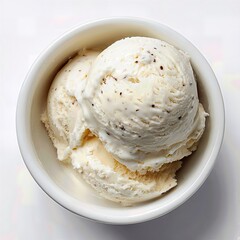 Creamy scoops of vanilla ice cream in a bowl top view white background