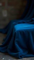 Close-up of rich dark blue velvet with soft folds and realistic texture, luxurious textile background with depth and softness
